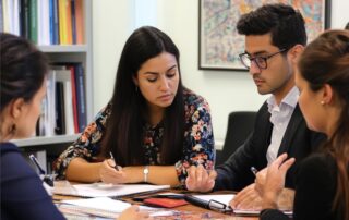 MBA students having a group discussion.